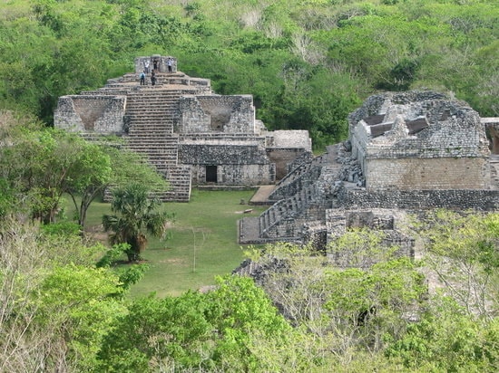 Panoramic view of the Ek Balam acropolis and twin pyramids rising above the Yucatan jungle