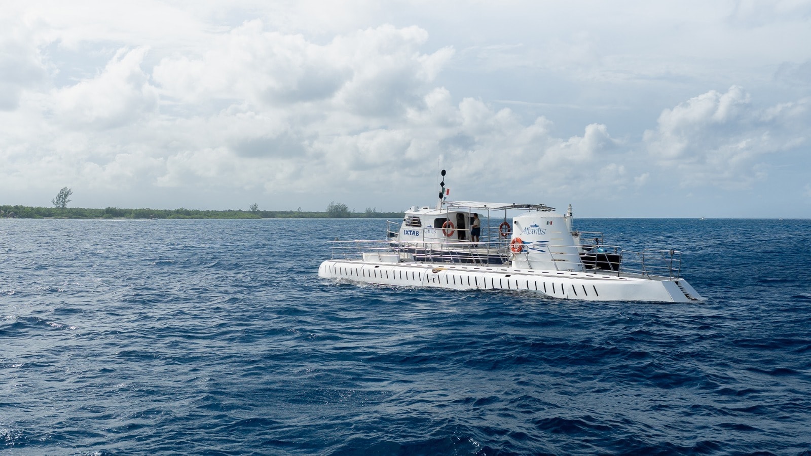The Atlantis XII tourist submarine on the surface of the Caribbean Sea off the coast of Cozumel, Mexico